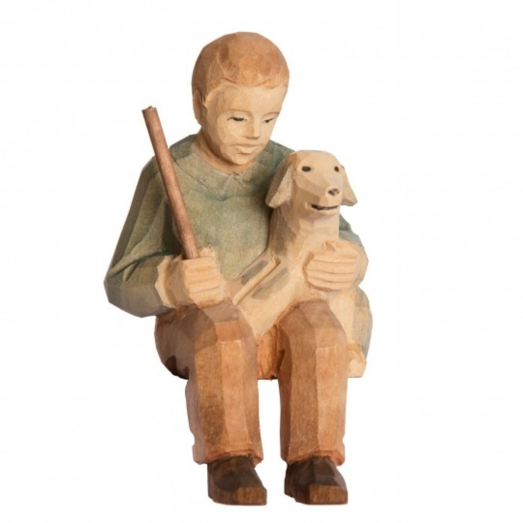 Junge sitzend mit Hund